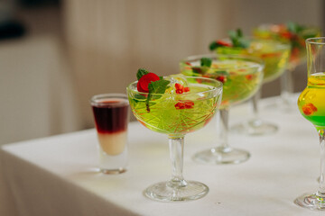Welcome drink with cocktail glasses and drinks at an event. Alcoholic beverages at a wedding