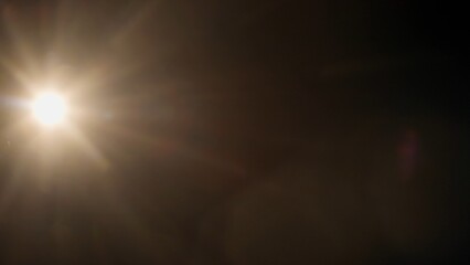 Real optical lens flare on black background