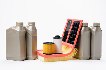 A set of engine oil and new filters for the engine. Car service concept. White background
