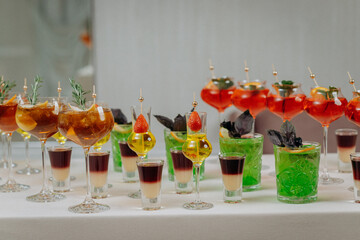 Welcome drink with cocktail glasses and drinks at an event. Alcoholic beverages at a wedding
