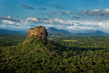 Sigiriya or Sinhagiri Lion Rock ancient rock fortress near Dambulla in Sri Lanka, historical and archaeological significance dominated by a massive column of granite, landscape view.