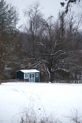 Barn in a snowy pasture