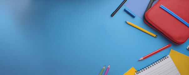 School supplies isolated on blue with empty space. Banner for text. Back to school concept