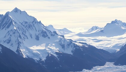 Obraz premium Snow-capped Mountain Peaks Against a Blue Sky.