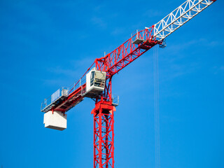 Construction crane or construction tower at the construction site of a large building.