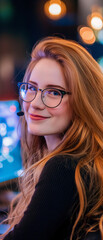 Obraz premium A young woman with red hair and glasses smiles happily as she plays video games at her vibrant desk adorned with colorful lights