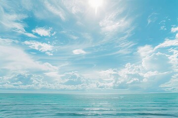 Obraz premium A person surfing in the ocean, with waves and sun