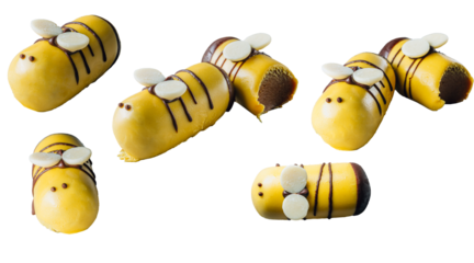 Bee cake pops on a plate over wooden background. Isolated