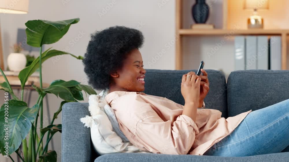 Sticker A laughing young woman texting on a phone at home. Cheerful female chatting to her friends on social media, browsing online and watching funny internet memes while relaxing on a sofa