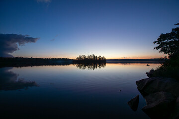 Sunset over a lake in Northern Ontario during a canoe trip.