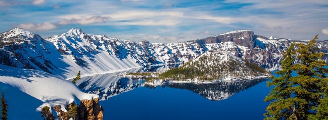 Snow covered rim of Crater Lake and Wizzard Island in Crater Lake National Park, Oregon. © Bob