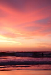 Beautiful sunset over the ocean with a calm beach