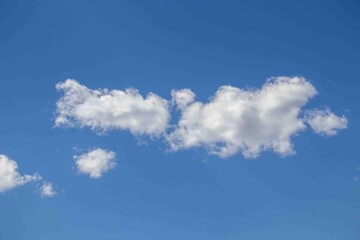 White clouds fly over with blue skies behind