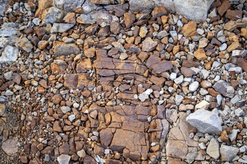 Close-Up Of Several Small Rust-Colored Rocks