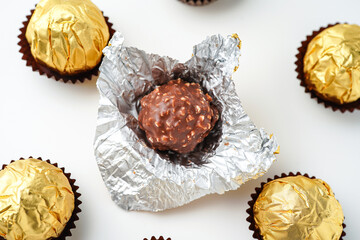 chocolate balls filled with hazelnuts, chocolate sweets in a gold wrapper