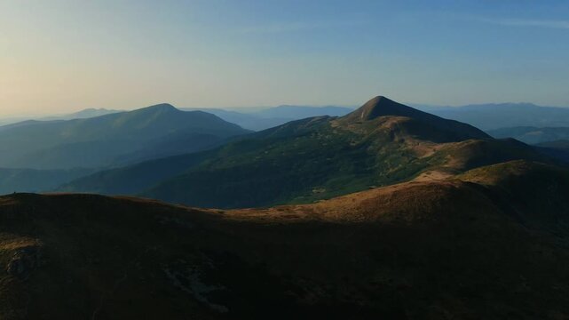 Hoverla (Goverla) the highest peak of the Ukrainian Carpathian mountains. Aerial drone view. Panoramic nature landscape of a valley, forest and hiking trails for travelers. Trekking outdoors.
