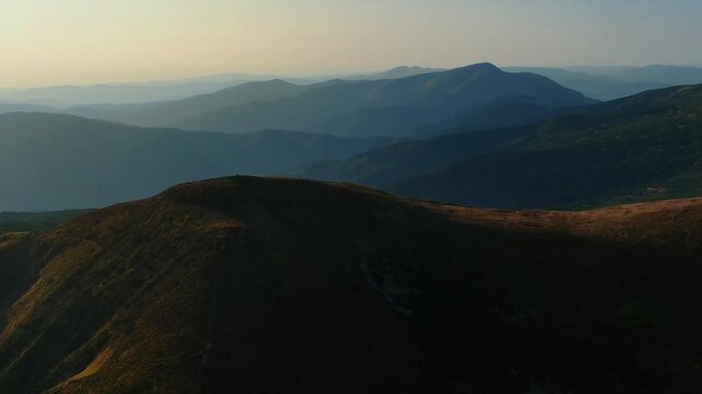 Hoverla (Goverla) the highest peak of the Ukrainian Carpathian mountains. Aerial drone view. Panoramic nature landscape of a valley, forest and hiking trails for travelers. Trekking outdoors.