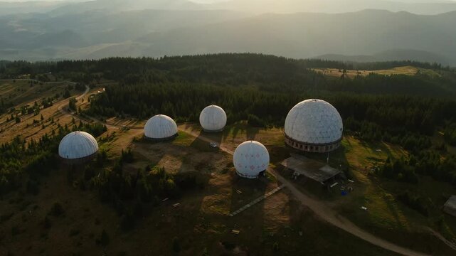Pamir old military radar station. Aerial view of abandoned secret army site, former radio locating station, Carpathian mountains, Ukraine. Futuristic architecture buildings in forest.