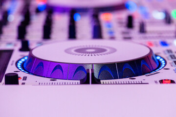 Dee Jay turn table music mixer extreme close up purple