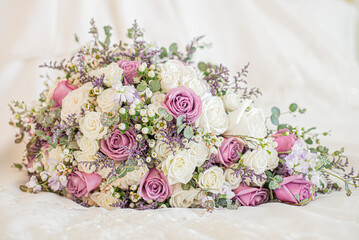Gorgeous white roses and pink roses bridal bouquet on white background