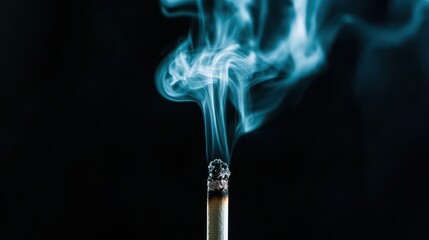 Close-Up of Burning Incense Stick with Smoke Against Black Background