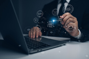 A man is drawing on a laptop screen with a pen. Concept of creativity and innovation, as the man is using a pen to draw on the computer screen