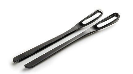 Obraz premium Black Plastic Tongs on a White Background