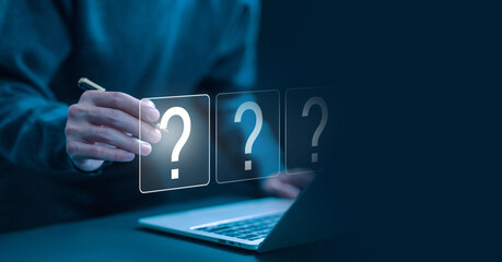 question mark shows on a laptop. concept of ask, answer, Business FAQ, Thinking, and wondering....