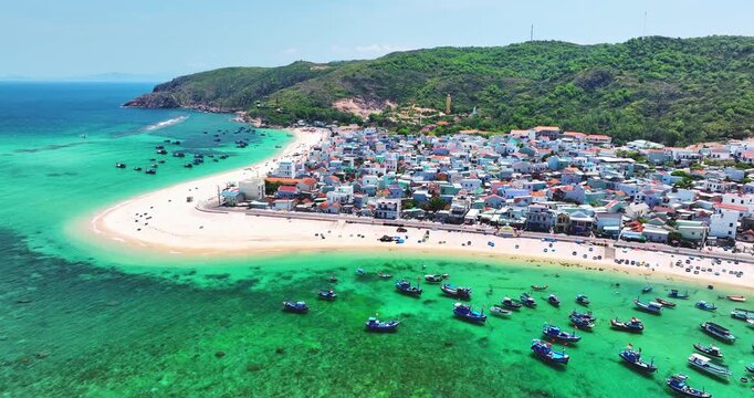 Aerial view of landscape of a fishing village and traditional fishing boat on the beach in Binh Dinh Province, Vietnam.