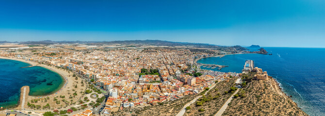 Aerial view of San Juan fort and popular beach in Aguilas Spain, popular Mediterranean tourist destination with turquoise water