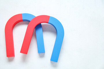 Horseshoe shaped magnets on white background