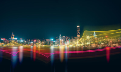 A vibrant night view of Hong Kong's skyline, with colorful lights reflecting on the water, showcasing the city's lively atmosphere and modern architecture.