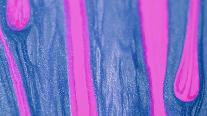 Shimmer ink. Sparkling paint. Defocused blue pink color spill glowing particles glossy fluid lines flow motion abstract art background.