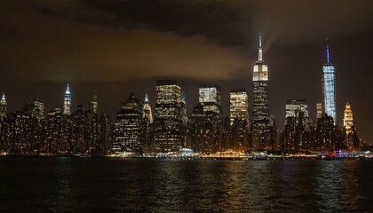 Obraz premium A night view of the Manhattan skyline from across the Hudson River 11