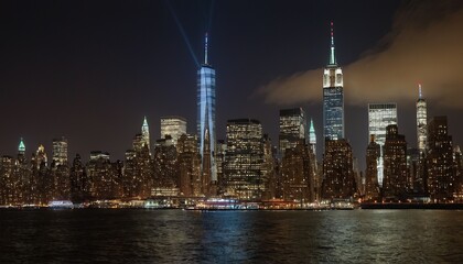 Obraz premium A night view of the Manhattan skyline from across the Hudson River 6