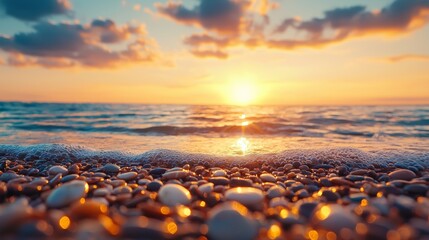 A serene sunset over a tranquil sea, with gentle waves lapping against a shore of smooth pebbles, creating a peaceful atmosphere.
