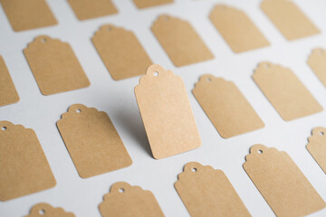 Mockup of a Mockup of a brown kraft paper price tag, standing out among other labels. with clipping path