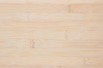 Fototapeta premium Natural wooden desk texture background, Top view. Abstract top bar table wood bamboo pattern nature. Design wall vintage interior kitchen. Bamboo skin cutting board empty for displaying products.