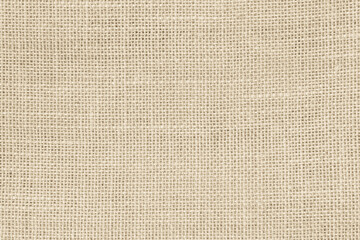 Closeup detail of beige fabric texture background. High resolution photo.