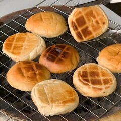 Top view of homemade sesame buns on a wooden