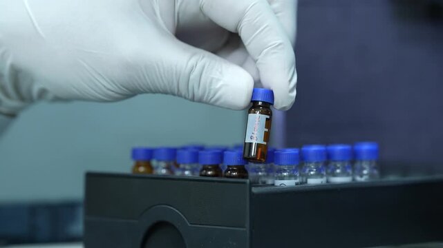 HPLC science experiment Vials filling inside an autosampler of an HPLC machine equipment inside view in a Scientific experimental laboratory for research development analysis and ipqa, footage in 4k	