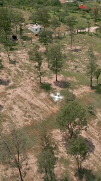 Dji drone used for topography flying in the air. In a countryside. Aerial drone view from above.