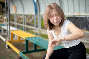 Fototapeta premium Woman checking smart watch after workout