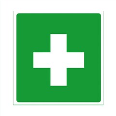 Obraz premium white medical cross on a green background