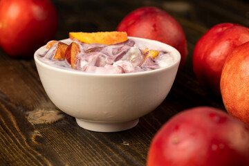 natural yogurt in a white bowl with fruits