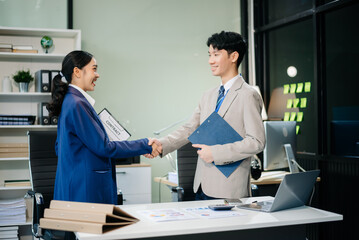 Two confident business man shaking hands during a meeting in the office, success, dealing, greeting and partner