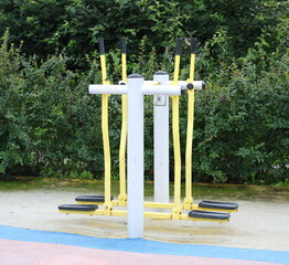 An on-site walking simulator on an outdoor sports field near bushes