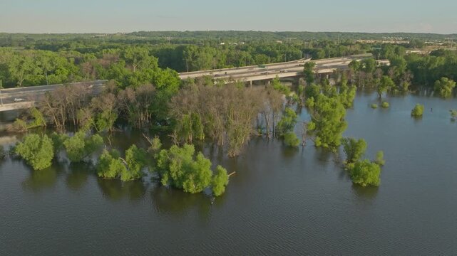4K CCW Orbiting Drone Shot Of Submerged Trees In Flooded Fisher Lake Savage MN