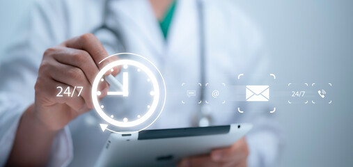Medical worker using tablet and touching on virtual screen contact icons email, address, live chat,...