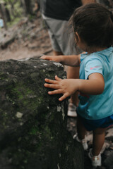 Little girl hiking a trail